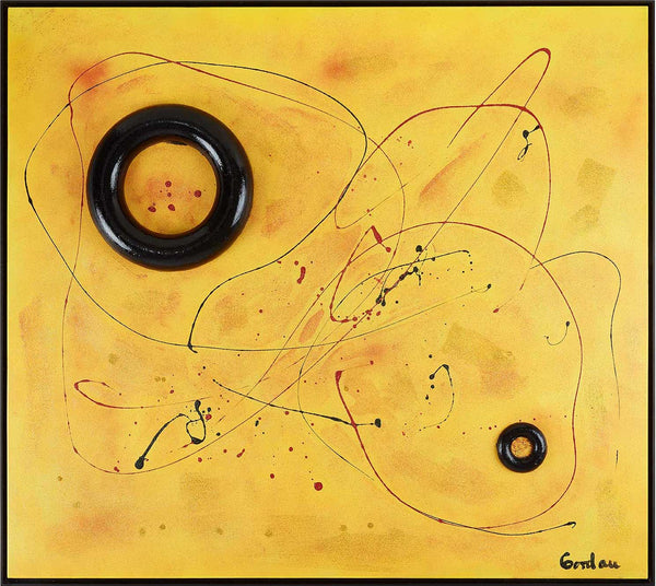 Two black rings on yellow with red spatter.