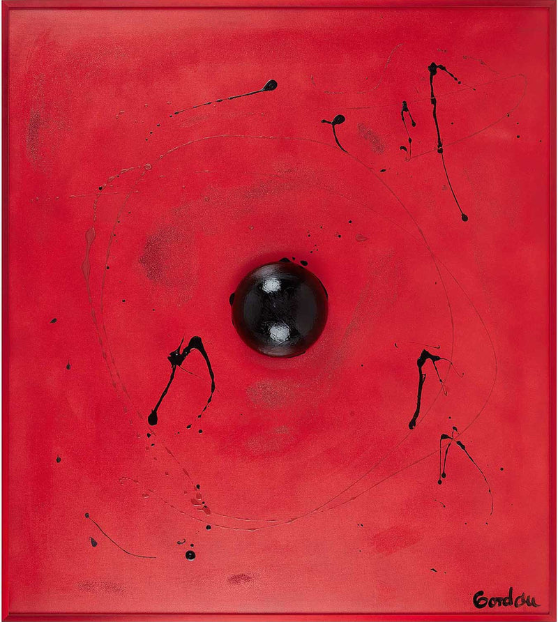 Black sphere on red with black spatters.