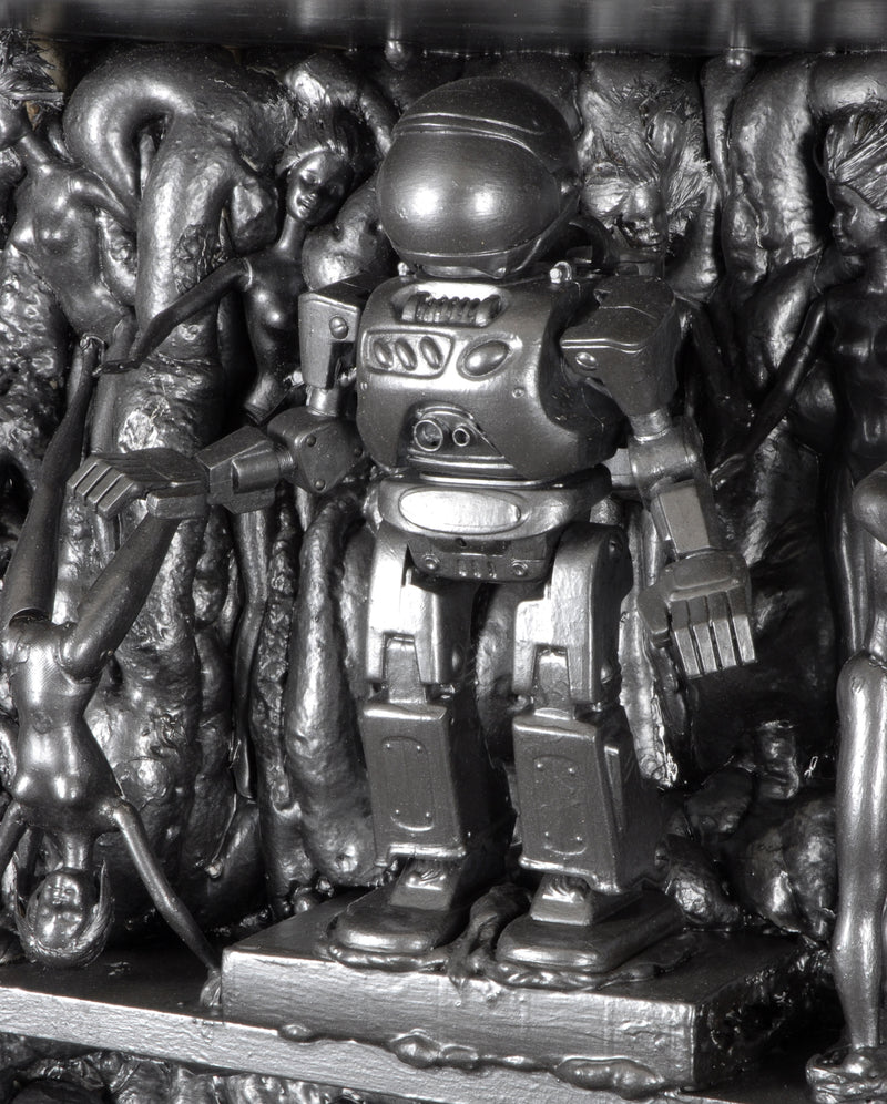 Close up of silver painted robot.